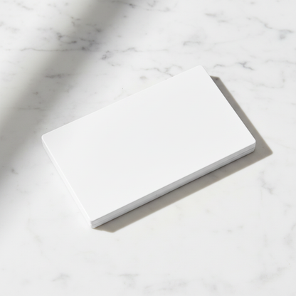 Matte white rectangular 8-pan eyeshadow palette closed showing clean minimalist exterior on marble surface