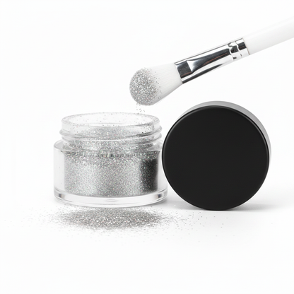 Clear glass jar with matte black lid filled with holographic silver fine glitter eyeshadow powder