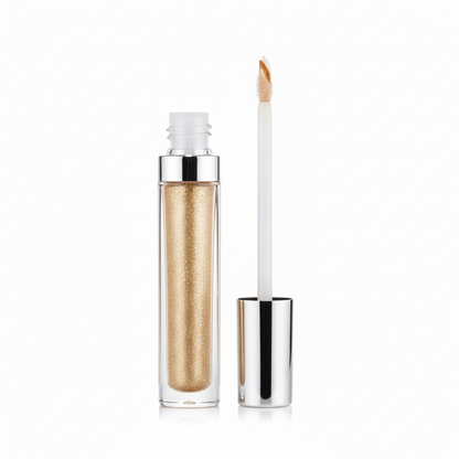 Clear glass tube liquid eyeshadow filled with champagne gold glitter, silver cap and doe-foot applicator shown open
