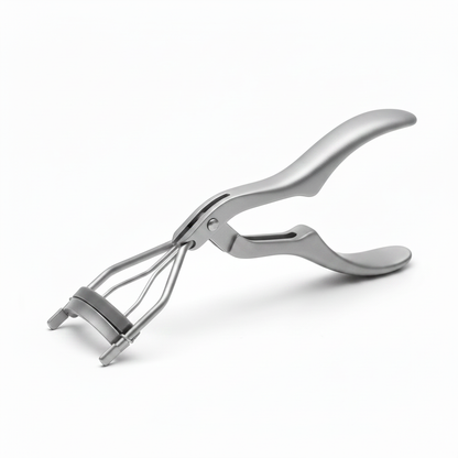 Matte silver grey ergonomic wide paddle-handle eyelash curler with triple spring wire clamp and grey silicone pad