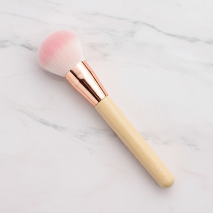 Fluffy dome blush brush with pink ombre bristles and rose gold ferrule