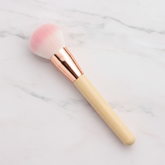 Fluffy dome blush brush with pink ombre bristles and rose gold ferrule